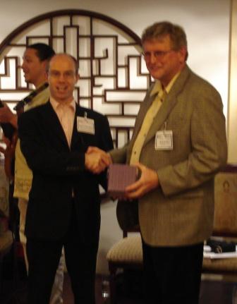 Dr. Bob Bruce (right) is presented with the Global Gypsum 2007 <em>'Personality of the Year' </em>award from Dr. Robert McCaffrey.  Dr. Bruce received the award for his many contributions to the industry over more than 30 years and for his company's continuing role in aiding the <br />
industry in terms of forecasting and technological advancement.